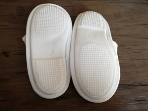 White and Gray Hotel Slippers